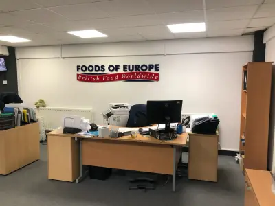 Foods of Europe British Food Worldwide wall sign above a beech office desk and printer