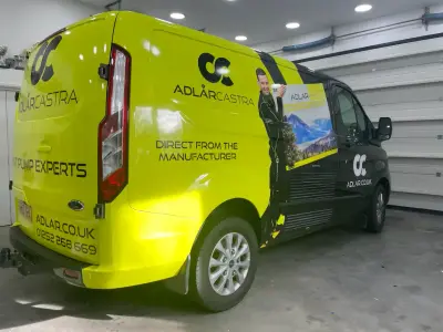 Adlar Castra lime-green full van wrap reading Direct From The Manufacturer, offside rear view