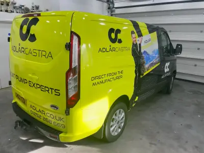 Lime-green Ford Transit Custom van, full wrap for Adlar Castra Heat Pump Experts, rear offside view