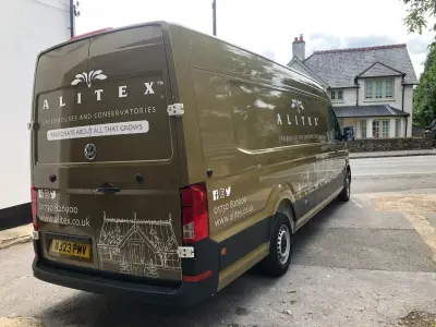 Alitex VW Crafter van in printed olive, full wrap, rear and nearside showing logo and contact details