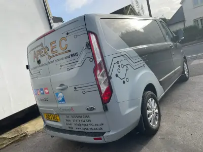 Silver Ford Transit Custom van, part wrap for Apex EC, rear and side circuit-board graphics