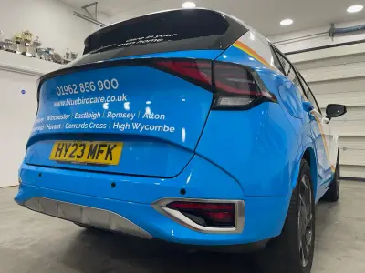 Bluebird Care blue Kia Sportage, full wrap, rear view with phone, website and town list
