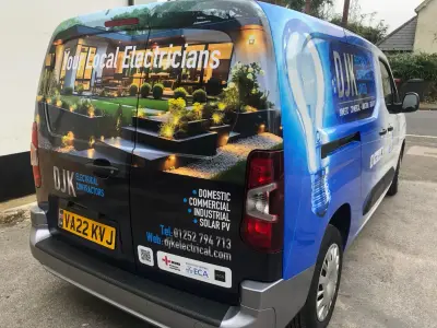 DJK Electrical Vauxhall Combo van, full wrap, rear left showing lit garden and lightbulb graphics