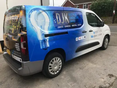 DJK Electrical Contractors van, full wrap, left side profile with large lightbulb graphic