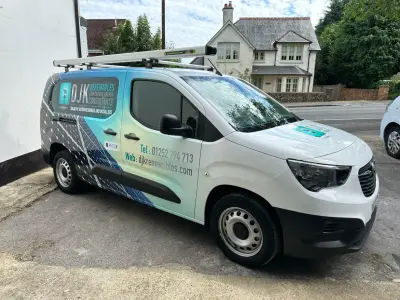 DJK Renewables Vauxhall Combo van, full wrap, right side profile with solar-panel design