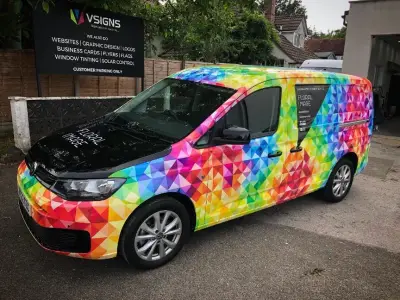 Floral Image rainbow VW Caddy van, full wrap, front three-quarter outdoors by VSIGNS sign