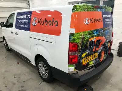 White van with Rod Gaskin Ltd Kubota tractor part wrap, driver-side rear view