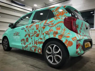 Silent Pool Gin turquoise Kia Picanto floral wrap, driver-side rear view