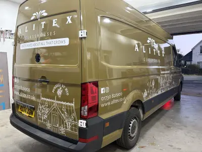 Rear of a large VW Crafter in printed Alitex olive with Alitex Glasshouses full wrap and greenhouse art