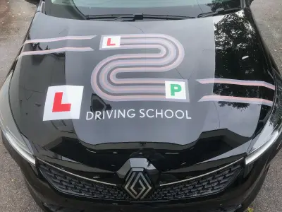 Black Renault bonnet with L2P Driving School graphic, L-plate and P-plate design