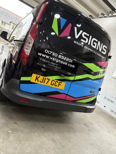 Rear of black Ford Transit Connect wrapped with V Signs Wraps Graphics & Signage branding