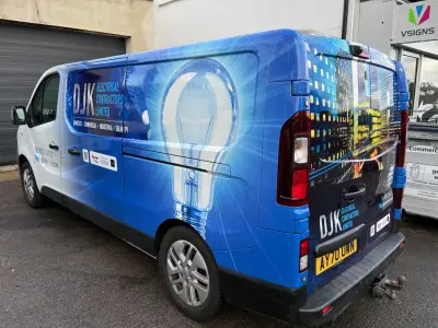 Blue DJK Electrical Renault Trafic van rear quarter with lightbulb wrap by V Signs unit