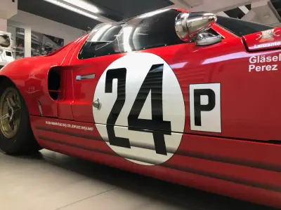 Close-up of red Ford GT40 with black 24 number roundel, 'P' and Glasel/Perez driver name decals