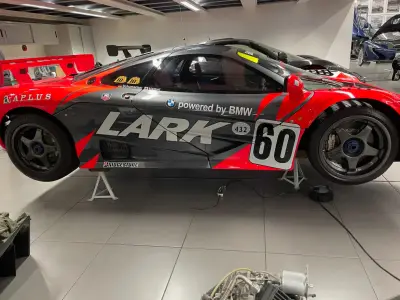 Grey and red Lark McLaren F1 GTR side view on stands, number 60 race livery