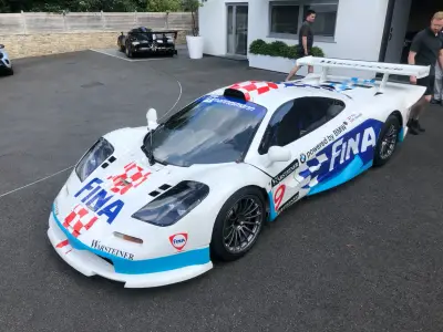 White and blue FINA Warsteiner McLaren F1 GTR number 9 being pushed outdoors