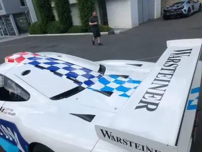 White McLaren F1 GTR rear deck with blue checkered wrap and Warsteiner wing lettering