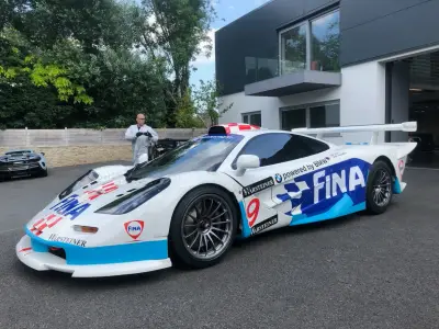 White and blue FINA Warsteiner McLaren F1 GTR number 9 side view outdoors