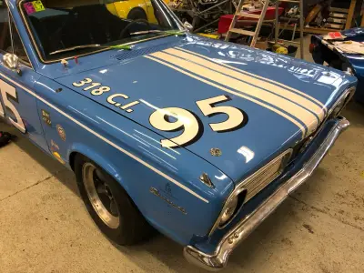 Blue Plymouth Barracuda bonnet with white number 95, twin stripes and 318 C.I. lettering