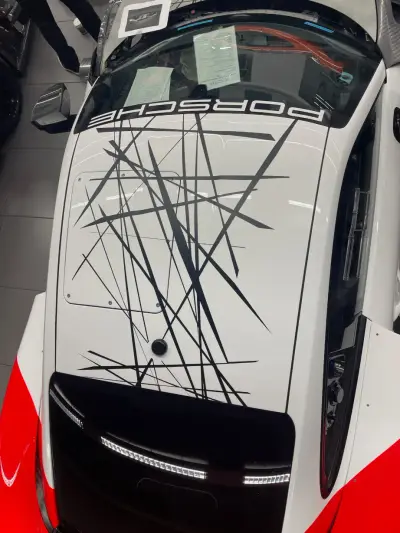 White Porsche 935 bonnet with PORSCHE banner and black scratch-line graphic wrap