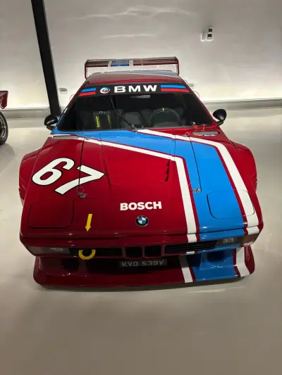 High-angle front of red BMW M1 Procar number 67 race livery