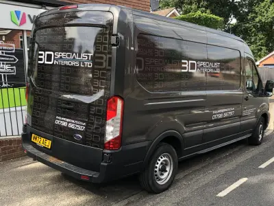 Grey Ford Transit part wrap with 3D Specialist Interiors Ltd branding, rear view