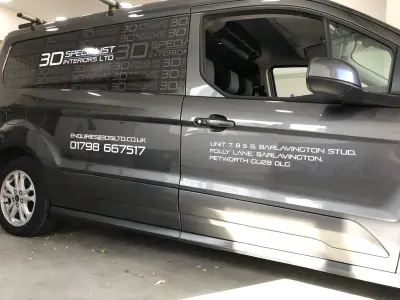 Grey van side detail with 3D Specialist Interiors Ltd graphics and contact details