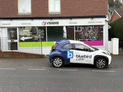 Bluebird Care wrapped Toyota Aygo X outside the V Signs shopfront in Liphook