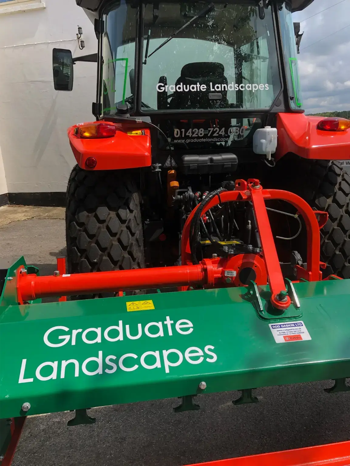 Plant machinery graphics by V Signs — Graduate Landscapes Kubota tractor cab branding, Hampshire