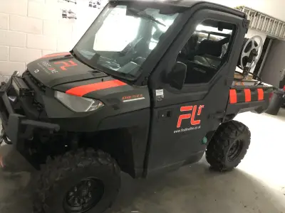 Grey Polaris Ranger diesel UTV with red First Line Fire FL graphics