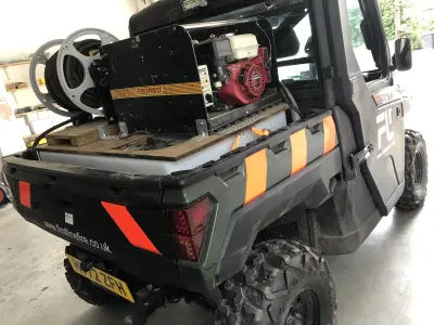 Rear of Polaris Ranger UTV with orange chevrons and First Line Fire Firexpress unit