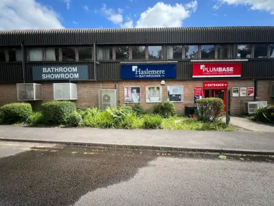 Trade-park building with Haslemere Bathrooms, Plumbase and Bathroom Showroom fascia signs
