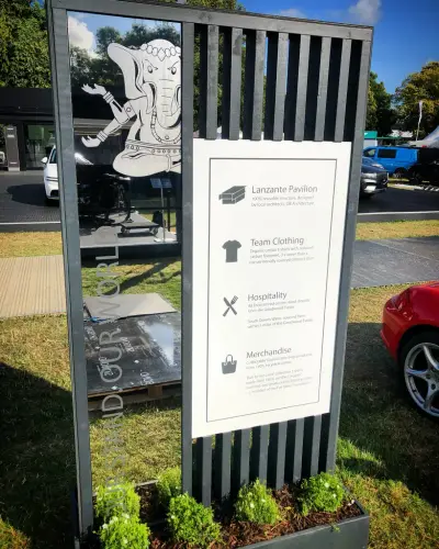 Lanzante event display panel with elephant graphic and printed information on a stand