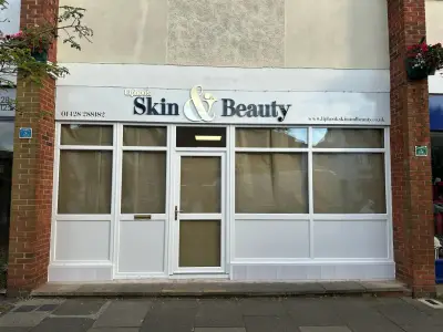 Liphook Skin & Beauty shopfront fascia with built-up lettering between brick pillars