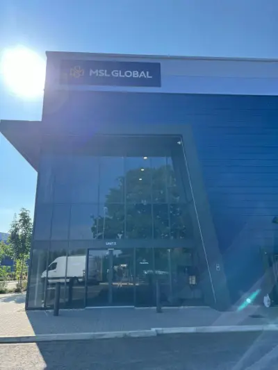 MSL Global Unit 3 blue warehouse with navy fascia sign against a clear sky
