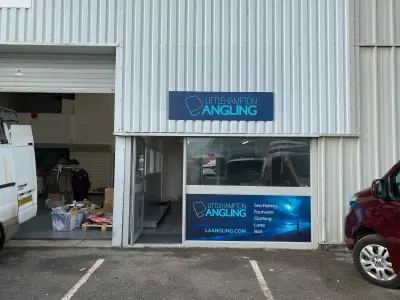 Littlehampton Angling unit fascia sign and blue window graphic listing sea fishing, clothing and bait