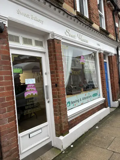 Sweet Bakery and Sweet Heaven shopfront signwriting with cake and sewing window graphics