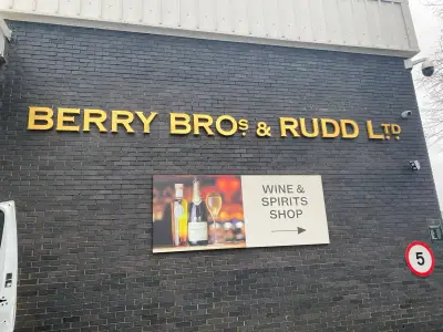Berry Bros & Rudd Ltd gold fascia lettering with a Wine & Spirits Shop directional sign