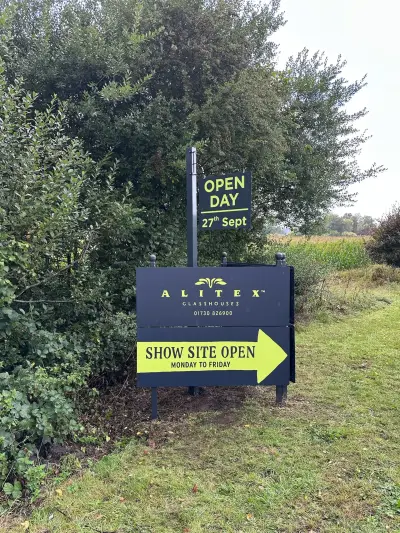 Alitex Glasshouses navy site board with Open Day hanging sign and Show Site Open arrow