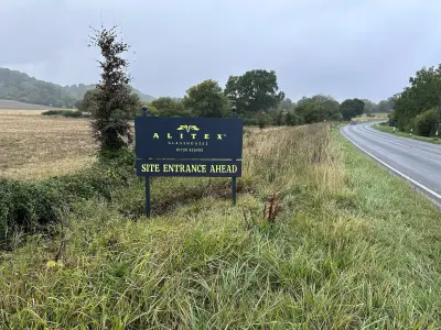 Alitex Glasshouses navy Site Entrance Ahead board on a rural roadside verge