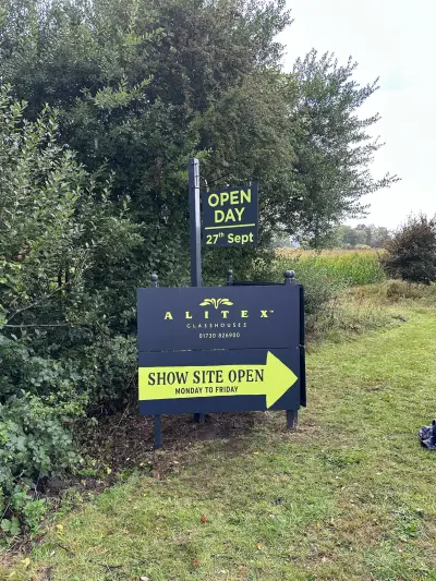Alitex Glasshouses site board with Open Day sign and Show Site Open arrow by a country road