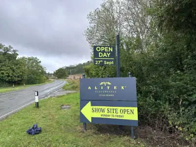 Alitex Glasshouses navy Open Day hanging sign above a Show Site Open board in a field