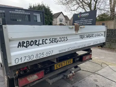 Arborlec Services white tipper truck dropside signwriting for tree surgery and fencing