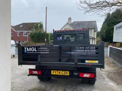 TMGL The Moseley Group black tipper truck rear dropside with white contact graphics