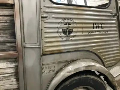 Silver Spitfire IWC Schaffhausen graphics applied to a vintage Citroen H van side panel