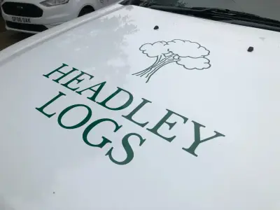 Green Headley Logs name and tree logo applied to the white bonnet of a pickup