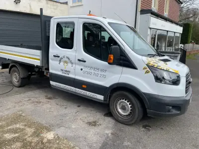 White Ford Transit crew-cab tipper with grey Arborlec Services tree-surgery door signwriting