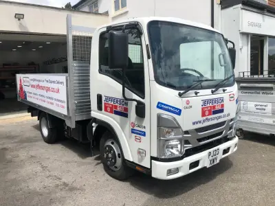 White Isuzu Jefferson Gas flatbed, front angle, with Calor and Campingaz branding