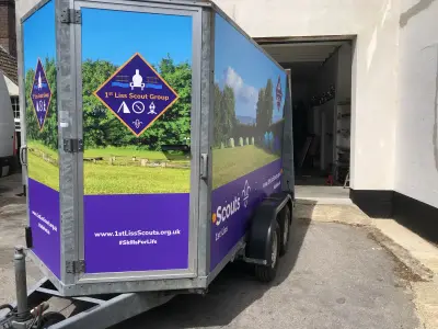Wrapped 1st Liss Scouts trailer with tents scene, front door and side graphics