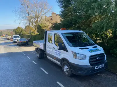 White Ford Transit crew-cab tipper signwritten Southdowns Builders Ltd, Extensions Roofing and Leadwork