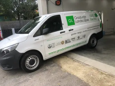 White Mercedes eVito van with Graduate Landscapes 100% Electric livery, side view